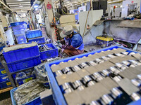 A worker works at an auto parts manufacturing enterprise in the Economic Development Zone of Qingzhou City, East China's Shandong Province,...