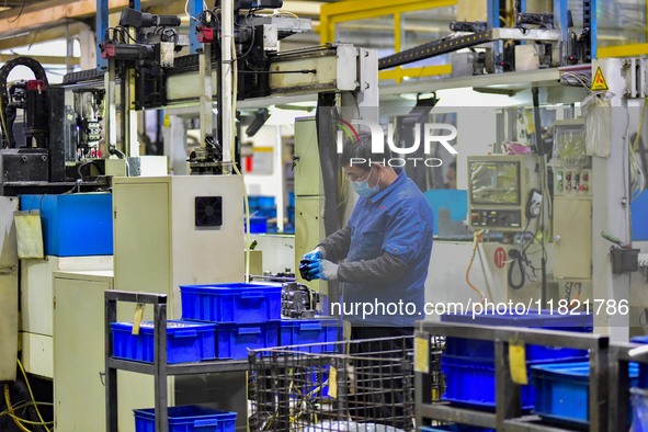 A worker works at an auto parts manufacturing enterprise in the Economic Development Zone of Qingzhou City, East China's Shandong Province,...