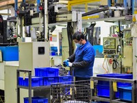 A worker works at an auto parts manufacturing enterprise in the Economic Development Zone of Qingzhou City, East China's Shandong Province,...