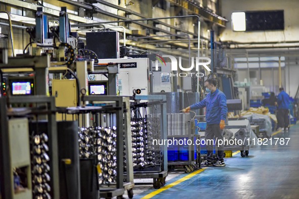 A worker works at an auto parts manufacturing enterprise in the Economic Development Zone of Qingzhou City, East China's Shandong Province,...