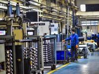 A worker works at an auto parts manufacturing enterprise in the Economic Development Zone of Qingzhou City, East China's Shandong Province,...