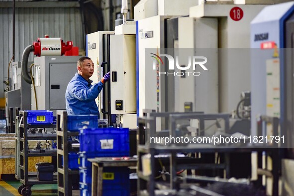 A worker works at an auto parts manufacturing enterprise in the Economic Development Zone of Qingzhou City, East China's Shandong Province,...