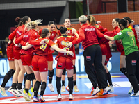 Players of Romania celebrate during the Romania vs. Czechia match at the Women's EHF EURO 2024 in Fonix Arena, Debrecen, on November 29, 202...