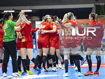 Players of Romania celebrate during the Romania vs. Czechia match at the Women's EHF EURO 2024 in Fonix Arena, Debrecen, on November 29, 202...