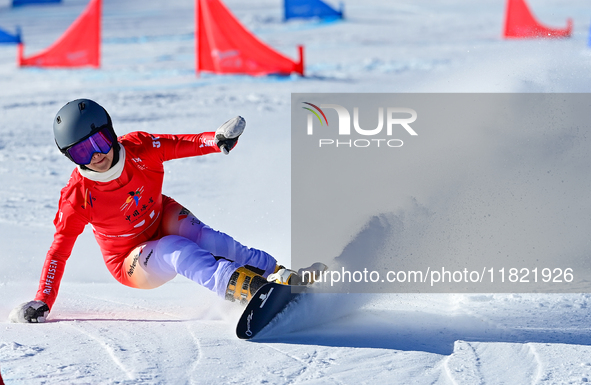 Betzky Vereinieva of Switzerland competes during the first round of the women's snowboard parallel giant slalom at the 2024-2025 ISF Snowboa...