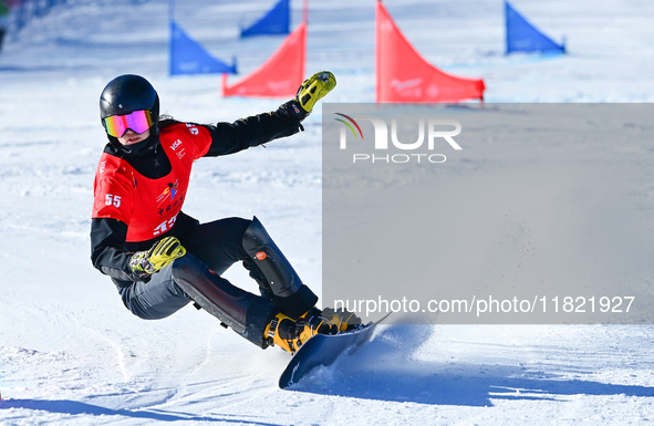 Peng Cheng of China competes during the first round of the women's snowboard parallel giant slalom at the 2024-2025 ISF Snowboard Parallel E...