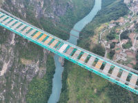 The Huajiang Canyon Bridge is under construction in Qianxinan, Guizhou province, China, on November 30, 2024. The bridge is a steel girder s...