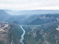 The Huajiang Canyon Bridge is under construction in Qianxinan, Guizhou province, China, on November 30, 2024. The bridge is a steel girder s...