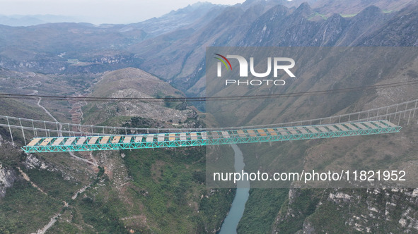 The Huajiang Canyon Bridge is under construction in Qianxinan, Guizhou province, China, on November 30, 2024. The bridge is a steel girder s...