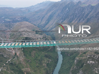 The Huajiang Canyon Bridge is under construction in Qianxinan, Guizhou province, China, on November 30, 2024. The bridge is a steel girder s...