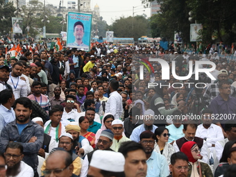 Activists from The All India Trinamool Congress take part in a protest meeting in Kolkata, India, on November 30, 2024, demanding the withdr...