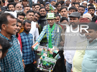 Activists from The All India Trinamool Congress take part in a protest meeting in Kolkata, India, on November 30, 2024, demanding the withdr...