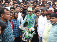 Activists from The All India Trinamool Congress take part in a protest meeting in Kolkata, India, on November 30, 2024, demanding the withdr...