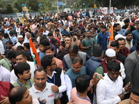 Activists from The All India Trinamool Congress take part in a protest meeting in Kolkata, India, on November 30, 2024, demanding the withdr...