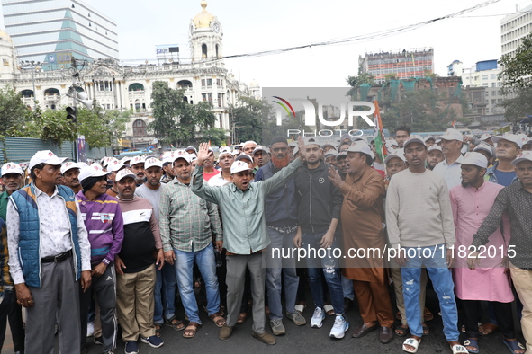 Activists from The All India Trinamool Congress take part in a protest meeting in Kolkata, India, on November 30, 2024, demanding the withdr...