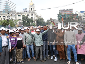 Activists from The All India Trinamool Congress take part in a protest meeting in Kolkata, India, on November 30, 2024, demanding the withdr...