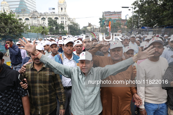 Activists from The All India Trinamool Congress take part in a protest meeting in Kolkata, India, on November 30, 2024, demanding the withdr...