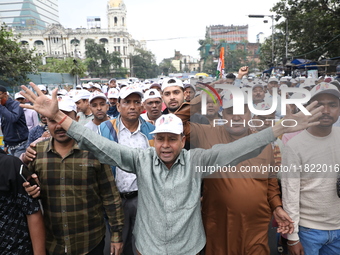 Activists from The All India Trinamool Congress take part in a protest meeting in Kolkata, India, on November 30, 2024, demanding the withdr...