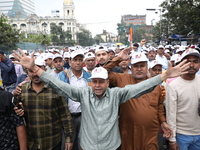 Activists from The All India Trinamool Congress take part in a protest meeting in Kolkata, India, on November 30, 2024, demanding the withdr...