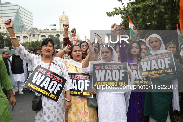 Activists from The All India Trinamool Congress take part in a protest meeting in Kolkata, India, on November 30, 2024, demanding the withdr...