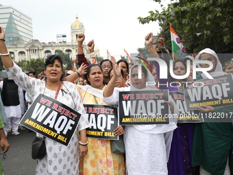 Activists from The All India Trinamool Congress take part in a protest meeting in Kolkata, India, on November 30, 2024, demanding the withdr...