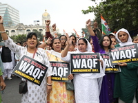 Activists from The All India Trinamool Congress take part in a protest meeting in Kolkata, India, on November 30, 2024, demanding the withdr...