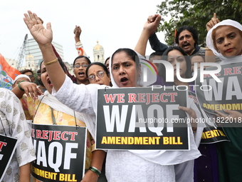 Activists from The All India Trinamool Congress take part in a protest meeting in Kolkata, India, on November 30, 2024, demanding the withdr...