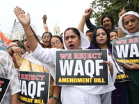 Activists from The All India Trinamool Congress take part in a protest meeting in Kolkata, India, on November 30, 2024, demanding the withdr...