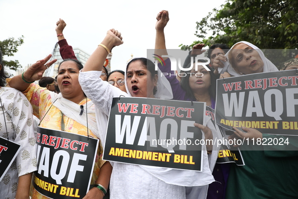 Activists from The All India Trinamool Congress take part in a protest meeting in Kolkata, India, on November 30, 2024, demanding the withdr...