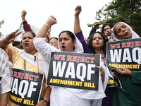 Activists from The All India Trinamool Congress take part in a protest meeting in Kolkata, India, on November 30, 2024, demanding the withdr...