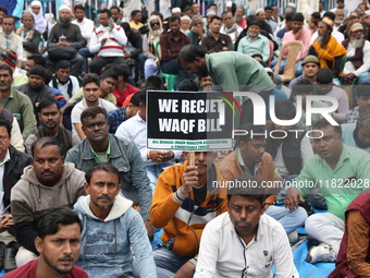 Activists from The All India Trinamool Congress take part in a protest meeting in Kolkata, India, on November 30, 2024, demanding the withdr...