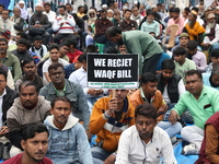 Activists from The All India Trinamool Congress take part in a protest meeting in Kolkata, India, on November 30, 2024, demanding the withdr...