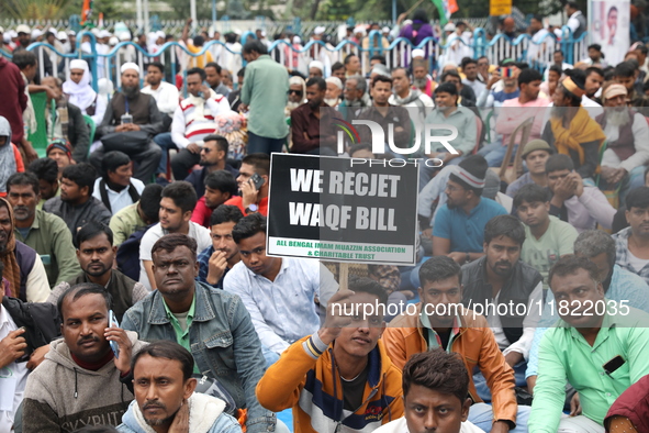 Activists from The All India Trinamool Congress take part in a protest meeting in Kolkata, India, on November 30, 2024, demanding the withdr...