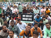 Activists from The All India Trinamool Congress take part in a protest meeting in Kolkata, India, on November 30, 2024, demanding the withdr...