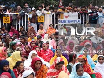 Activists from The All India Trinamool Congress take part in a protest meeting in Kolkata, India, on November 30, 2024, demanding the withdr...