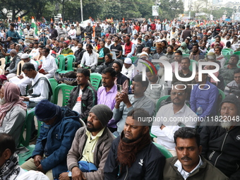 Activists from The All India Trinamool Congress take part in a protest meeting in Kolkata, India, on November 30, 2024, demanding the withdr...