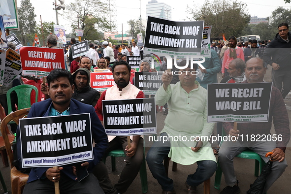 Activists from The All India Trinamool Congress take part in a protest meeting in Kolkata, India, on November 30, 2024, demanding the withdr...