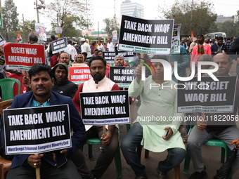 Activists from The All India Trinamool Congress take part in a protest meeting in Kolkata, India, on November 30, 2024, demanding the withdr...