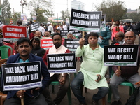 Activists from The All India Trinamool Congress take part in a protest meeting in Kolkata, India, on November 30, 2024, demanding the withdr...