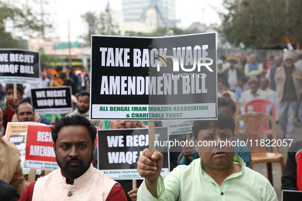 Activists from The All India Trinamool Congress take part in a protest meeting in Kolkata, India, on November 30, 2024, demanding the withdr...