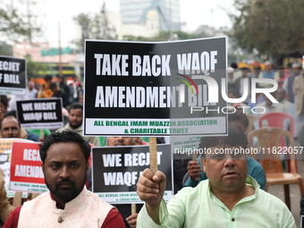 Activists from The All India Trinamool Congress take part in a protest meeting in Kolkata, India, on November 30, 2024, demanding the withdr...