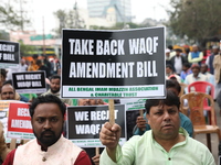 Activists from The All India Trinamool Congress take part in a protest meeting in Kolkata, India, on November 30, 2024, demanding the withdr...