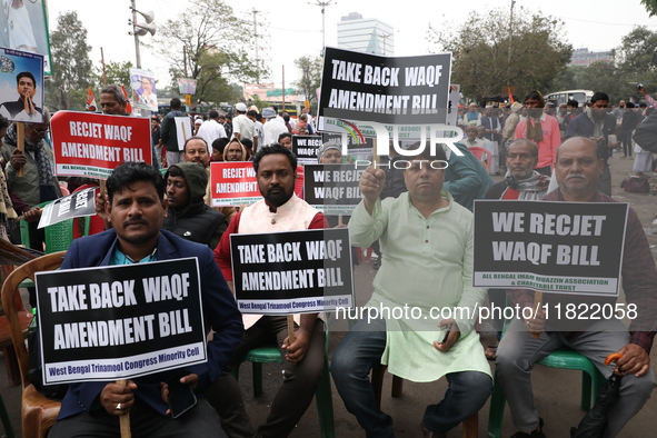 Activists from The All India Trinamool Congress take part in a protest meeting in Kolkata, India, on November 30, 2024, demanding the withdr...