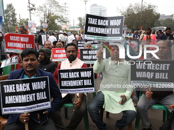 Activists from The All India Trinamool Congress take part in a protest meeting in Kolkata, India, on November 30, 2024, demanding the withdr...