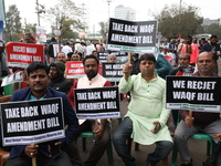 Activists from The All India Trinamool Congress take part in a protest meeting in Kolkata, India, on November 30, 2024, demanding the withdr...