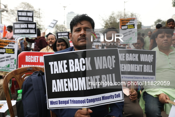 Activists from The All India Trinamool Congress take part in a protest meeting in Kolkata, India, on November 30, 2024, demanding the withdr...