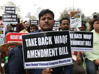 Activists from The All India Trinamool Congress take part in a protest meeting in Kolkata, India, on November 30, 2024, demanding the withdr...