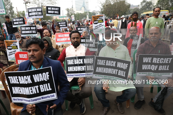 Activists from The All India Trinamool Congress take part in a protest meeting in Kolkata, India, on November 30, 2024, demanding the withdr...