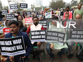 Activists from The All India Trinamool Congress take part in a protest meeting in Kolkata, India, on November 30, 2024, demanding the withdr...