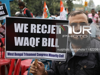 Activists from The All India Trinamool Congress take part in a protest meeting in Kolkata, India, on November 30, 2024, demanding the withdr...